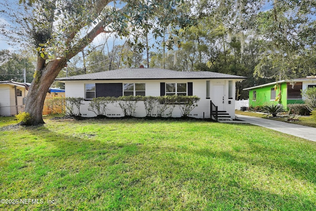 ranch-style home featuring a front yard