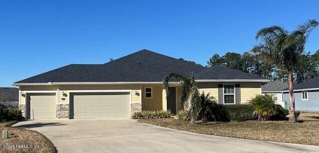 ranch-style house featuring a garage