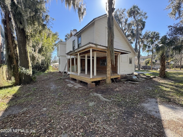 back of property with a wooden deck