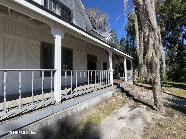 view of side of home with a porch