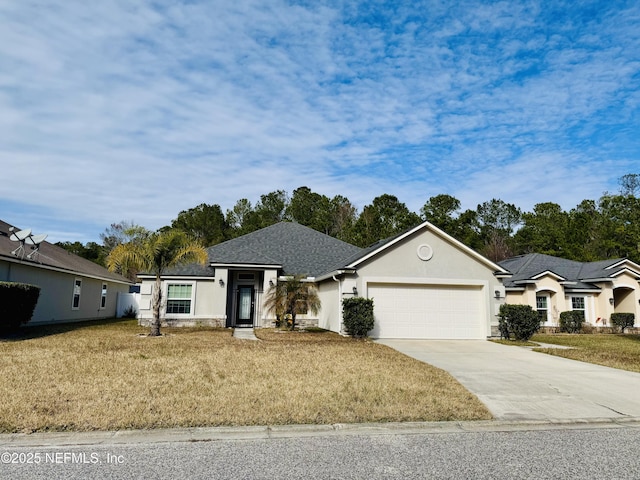 ranch-style home featuring a garage and a front lawn