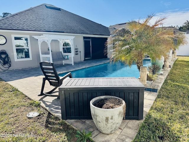 view of swimming pool featuring a hot tub and a patio