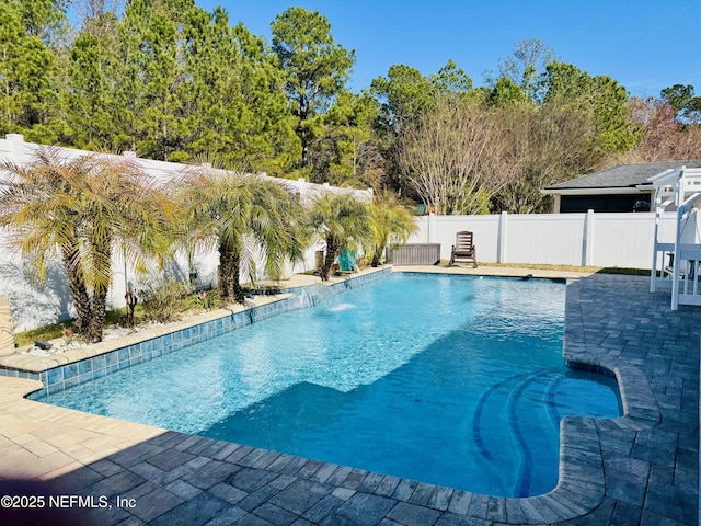 view of swimming pool featuring a patio and pool water feature