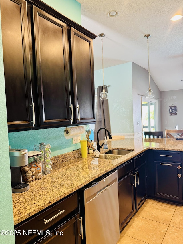 kitchen featuring lofted ceiling, sink, hanging light fixtures, stainless steel dishwasher, and light stone counters