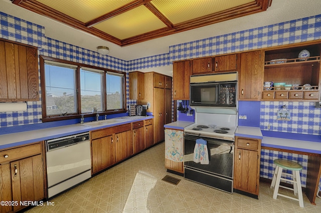 kitchen with electric stove, sink, crown molding, dishwasher, and tasteful backsplash