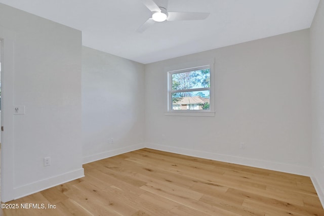 spare room featuring ceiling fan and light hardwood / wood-style flooring