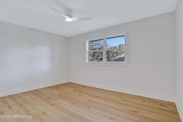 spare room featuring ceiling fan and light hardwood / wood-style flooring