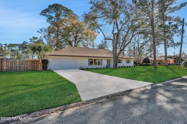 ranch-style house featuring a garage and a front yard