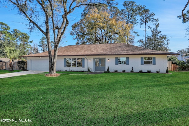 single story home featuring a garage and a front yard