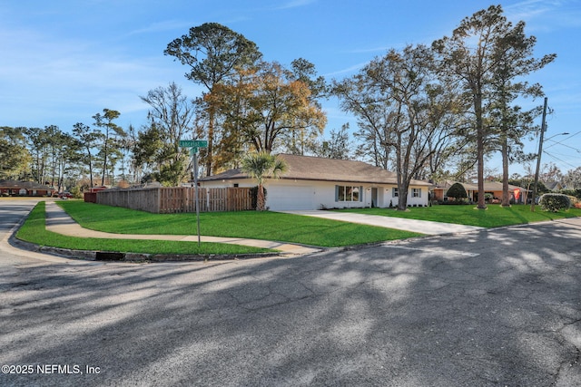 single story home with a garage and a front yard