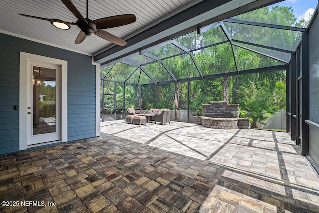 view of patio / terrace featuring an outdoor living space, a lanai, and ceiling fan