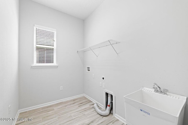 washroom with electric dryer hookup, sink, and hookup for a washing machine