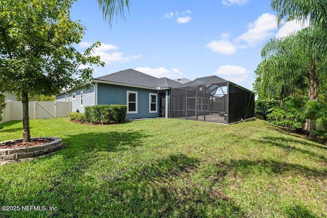 rear view of house with a yard