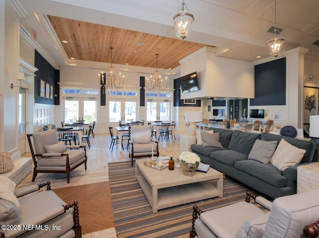 living room with an inviting chandelier, ornamental molding, wooden ceiling, and light hardwood / wood-style floors