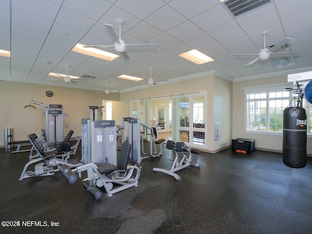 gym featuring crown molding and ceiling fan