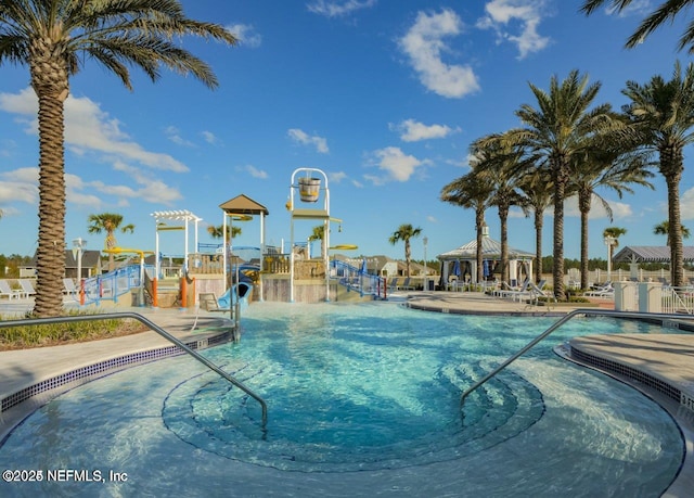 view of pool featuring a playground