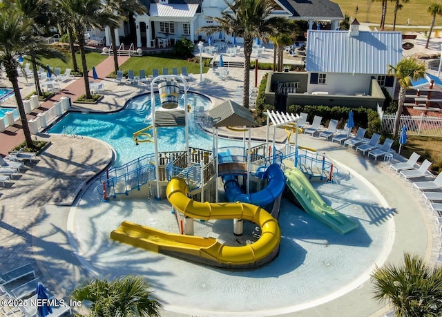 view of pool featuring a patio and a water slide