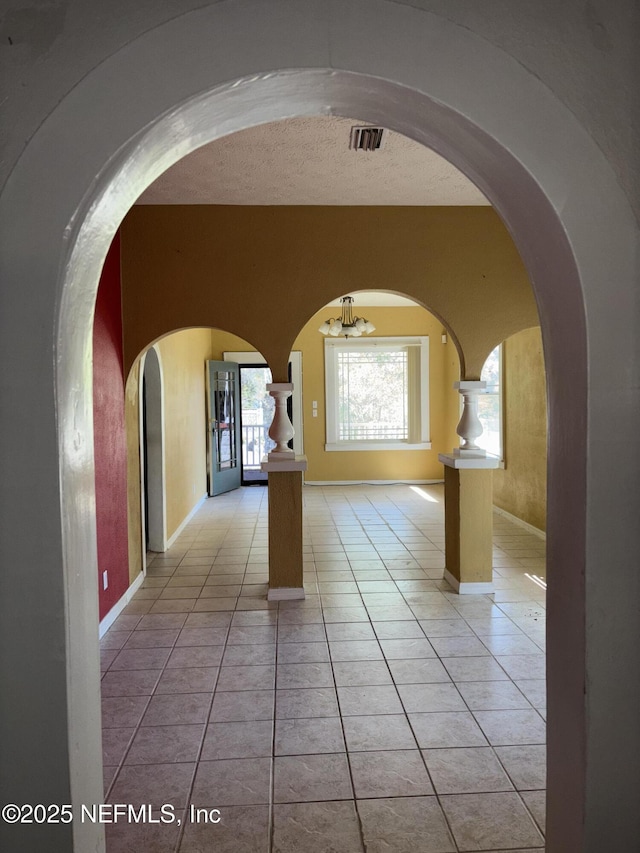 hallway with light tile patterned floors