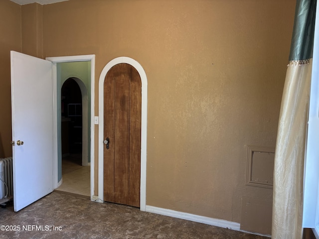 unfurnished room with radiator