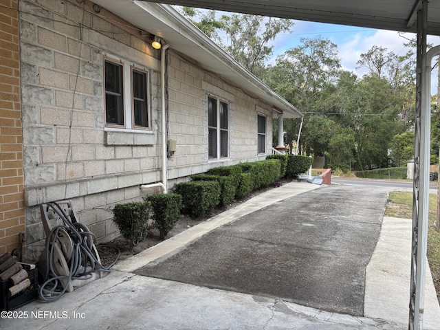 view of side of home featuring a patio area