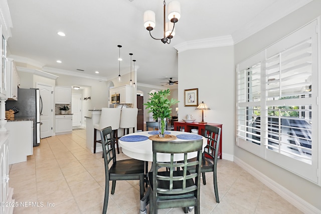 dining room with light tile patterned floors, crown molding, and ceiling fan with notable chandelier