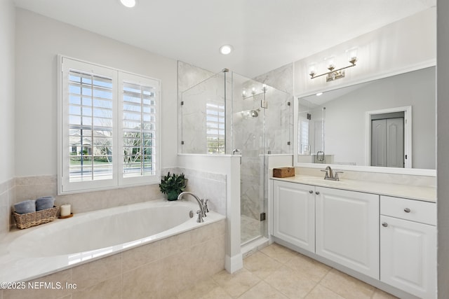 bathroom with vanity, tile patterned floors, and plus walk in shower