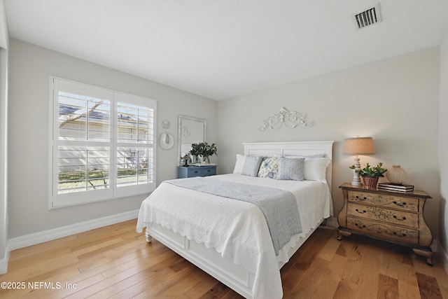 bedroom with hardwood / wood-style floors