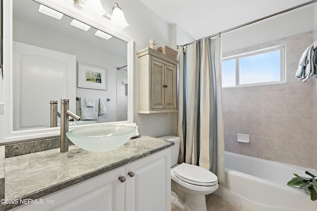 full bathroom featuring shower / tub combo, vanity, and toilet