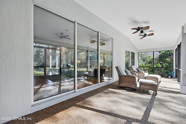 sunroom / solarium with vaulted ceiling and ceiling fan