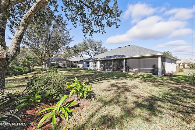 view of yard with a sunroom