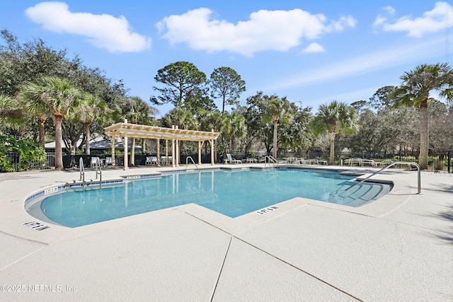 view of swimming pool with a pergola and a patio