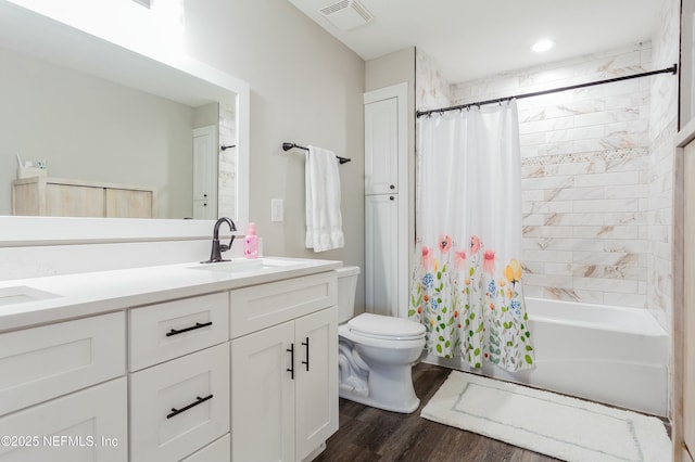 full bathroom featuring shower / bathtub combination with curtain, vanity, wood-type flooring, and toilet