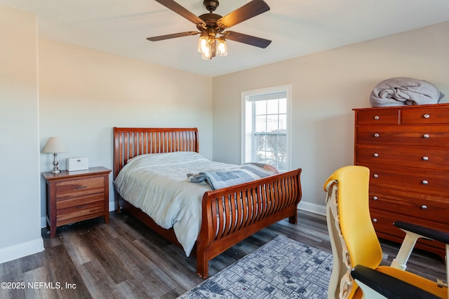 bedroom with ceiling fan and dark hardwood / wood-style flooring