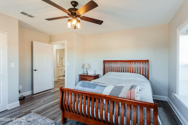 bedroom with dark wood-type flooring and ceiling fan