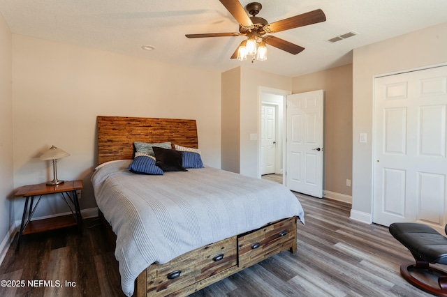 bedroom featuring dark wood-type flooring and ceiling fan