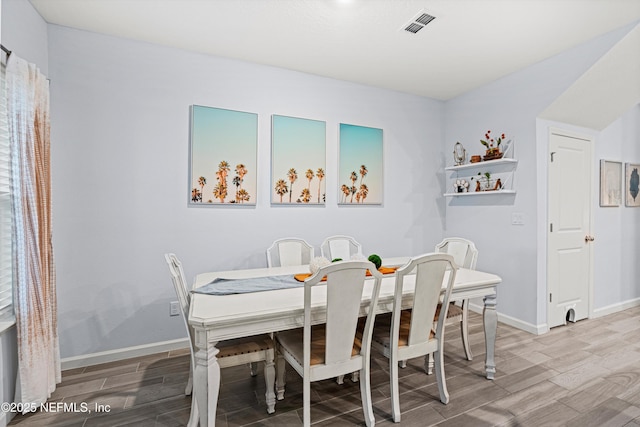 dining space featuring hardwood / wood-style floors