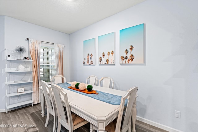 dining area with hardwood / wood-style floors