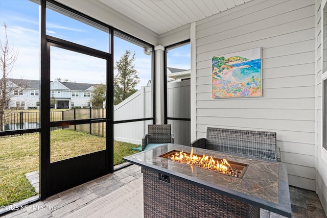 sunroom with a water view