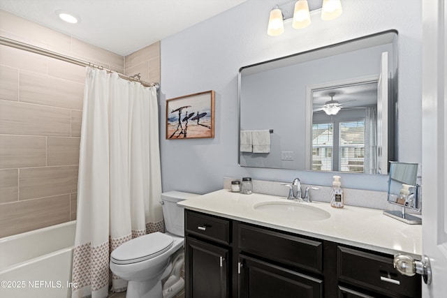 full bathroom featuring ceiling fan, vanity, toilet, and shower / bath combo with shower curtain