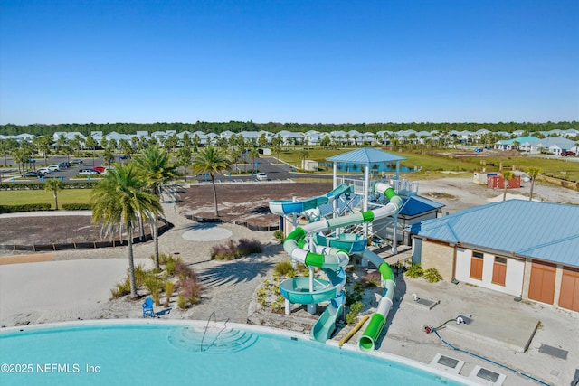 view of pool with a gazebo and a water slide