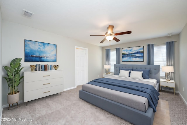 carpeted bedroom with ceiling fan