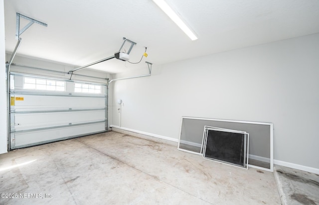 garage featuring a garage door opener