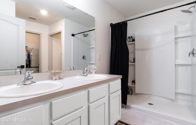 bathroom featuring vanity and a shower with curtain