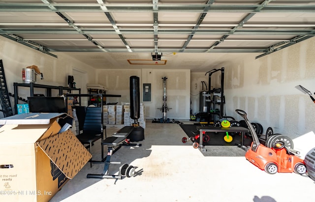 garage featuring a garage door opener and electric panel