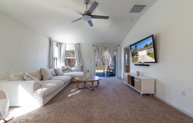 carpeted living room featuring ceiling fan and lofted ceiling