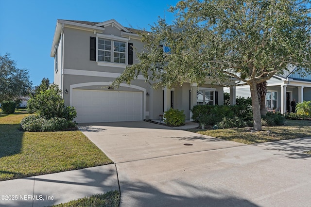 view of front of property featuring a garage and a front lawn