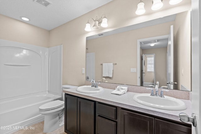 full bathroom with vanity, tile patterned flooring, toilet, and washtub / shower combination