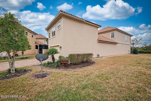 view of property exterior featuring a garage and a lawn