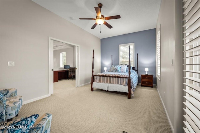 bedroom with ceiling fan and light colored carpet