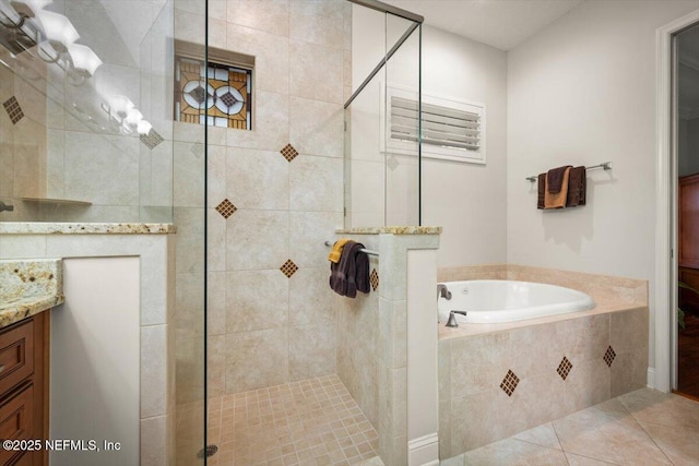 bathroom featuring vanity, tile patterned flooring, and independent shower and bath